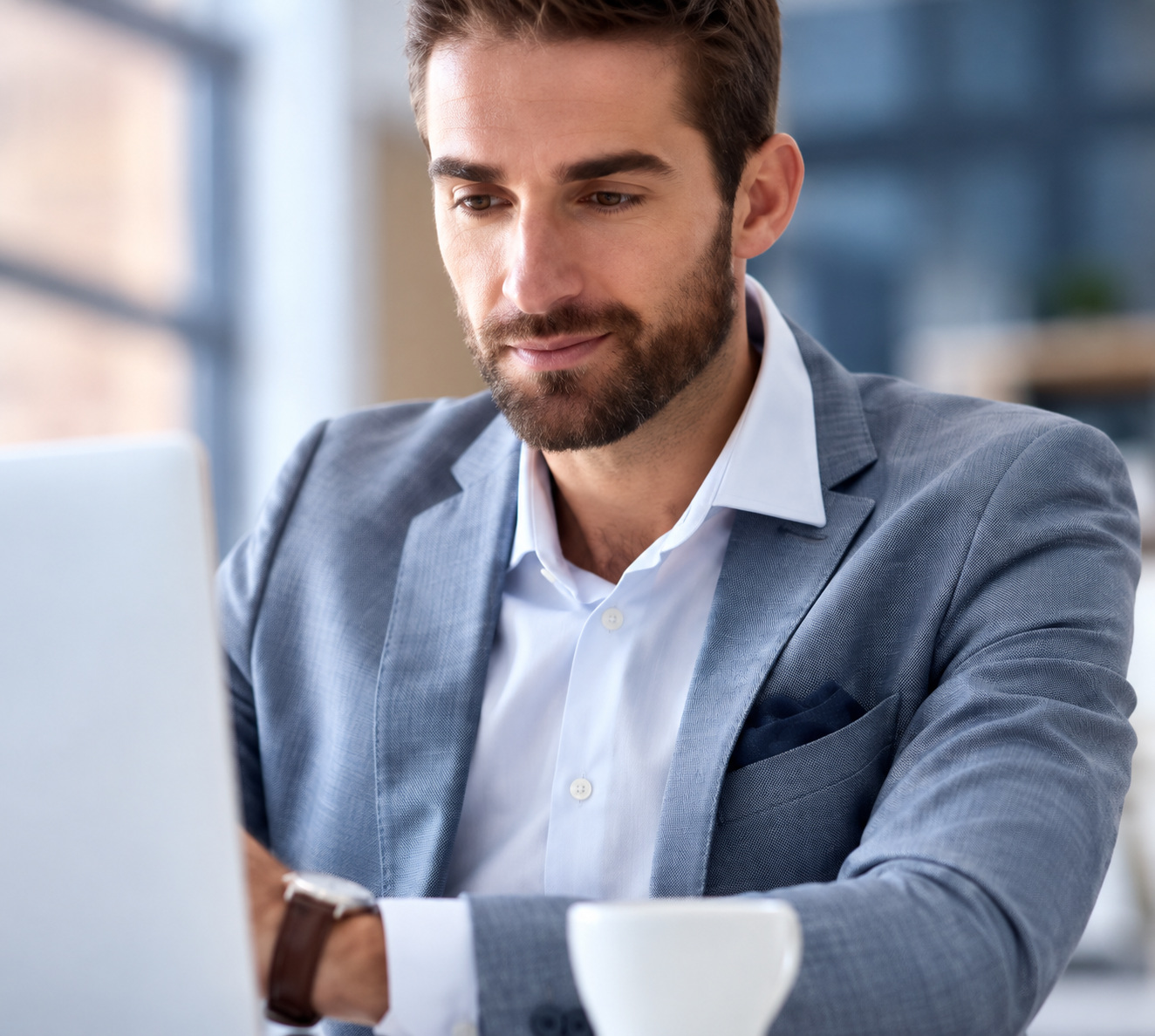 An illustrative professional working at a laptop